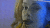 a woman is looking at herself in a mirror