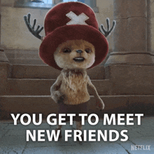 a stuffed animal wearing a red hat and antlers says you get to meet new friends