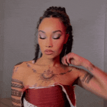 a woman has a tattoo on her chest that says ' i love you '