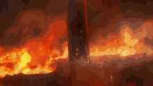 a large fire is coming out of a dark room