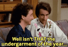 two men are sitting on a couch and one of them says " well isn 't that the undergarment of the year ... "