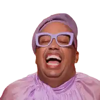 a man wearing glasses and a purple hat is laughing