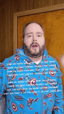 a man with a beard is wearing a captain america pajama shirt