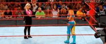 a woman in a wrestling ring with the nextbigthing written on the bottom of the screen