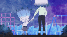 a man and a boy holding hands in front of a swing set