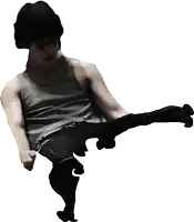 a man wearing a tank top and a black hat is kicking something