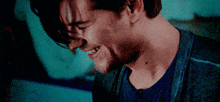 a close up of a man 's face with a blurry background