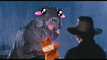 a man in a cowboy hat stands in front of a t-rex