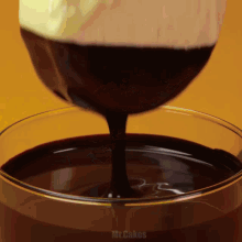 a close up of chocolate being poured into a glass