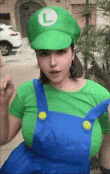 a woman dressed as luigi from super mario