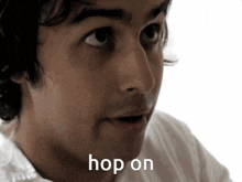 a close up of a man 's face with the word hop on written below it
