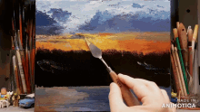 a painting is being painted with a spatula and the words made in animotica are visible