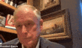 a man in a suit with the name president quayle on the bottom