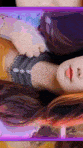 a picture of a woman laying down with a purple frame around her