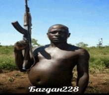 a shirtless man is holding a gun in a field with bagdan228 written on the bottom right