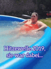 a picture of a woman in a pool with the words hitzewelle 2019 sie war dabei