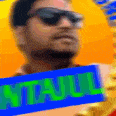 a blurry picture of a man holding a sign that says atlajuul