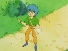 a boy in a green shirt carrying a girl in a blue dress