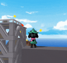 a cartoon character wearing a green hat and scarf stands on a ledge overlooking the ocean