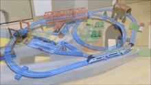 a blurred image of a toy train set with a tunnel