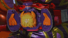 a toy with a purple and orange object inside