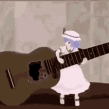 Monita China Tocando Guitarra GIF