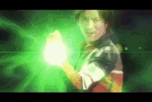 a man is holding a green glowing object in his hand .