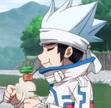 a boy with a bandana on his head is eating a skewer .