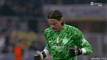 a soccer player wearing a green jersey that says betsson sport on it
