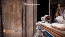 a person holding a sniper rifle in a video game with the number 18 on the screen