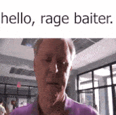 a man in a purple shirt is standing in a room with the words `` hello , rage baiter '' on the bottom .