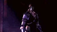 a close up of a person 's face in a dark room with purple smoke coming out of it .