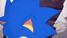 a close up of sonic the hedgehog 's face with a yellow eye