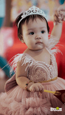 a baby girl wearing a pink dress and a tiara with the words hey creatives on the bottom