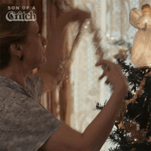 Decorating Christmas Tree Mary GIF - Decorating Christmas Tree Mary Son Of A Critch GIFs