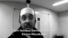 a black and white photo of a man wearing a samurai warrior costume and talking .