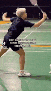 a man is holding a badminton racket on a court with a caption that says pov bila kau dah penat2