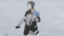 a man is carrying a girl in his arms while kneeling in the snow