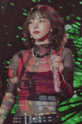 a woman wearing a red shirt that says " les nuits "
