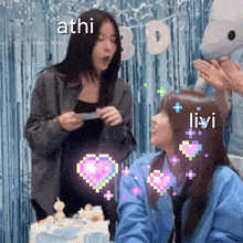 athi and livi are standing next to each other