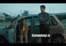 a man and a woman standing next to a car with the words starttamilchat.in on the bottom right