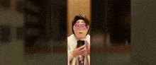 a woman with a mask on her face is looking at a cell phone