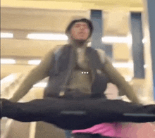 a man is sitting on a suitcase with his legs crossed