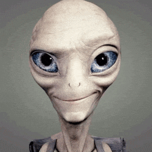 a gray alien with blue eyes is smiling and looking at the camera