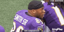 a football player with the name smith sr on his back