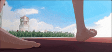 a person 's feet are visible in front of a tower