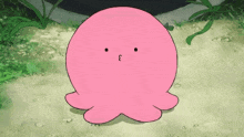 a pink cartoon octopus is making a funny face while sitting on the ground .
