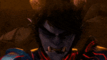 a person in a red costume is surrounded by red flames .