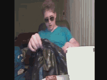 a man wearing sunglasses and a blue shirt is holding a trash bag that says family trash rescue on it