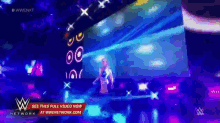 a wwe network advertisement shows a woman on stage